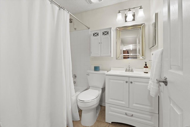 full bath featuring vanity, tile patterned flooring, shower / bath combination with curtain, a textured ceiling, and toilet