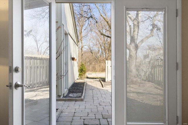 doorway featuring brick floor