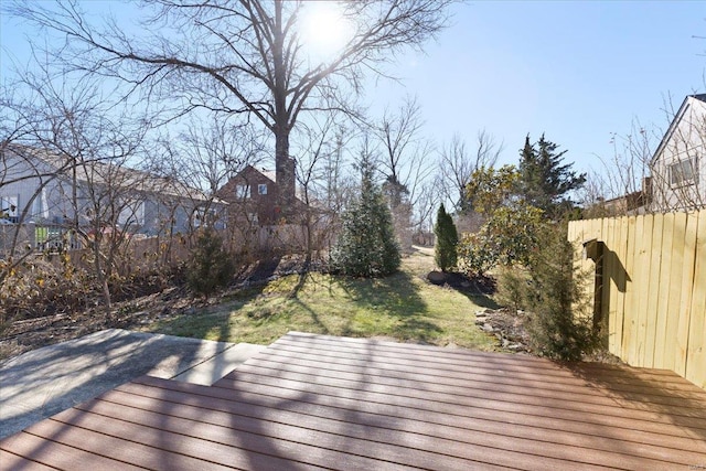 wooden deck with a lawn