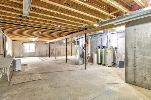 basement with heating unit and electric water heater