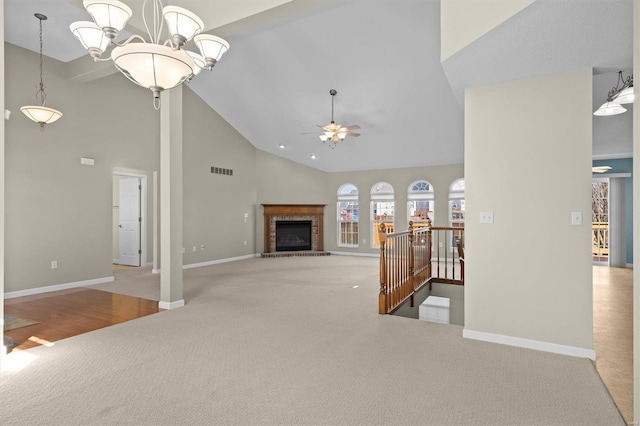 unfurnished living room featuring baseboards, visible vents, and carpet flooring