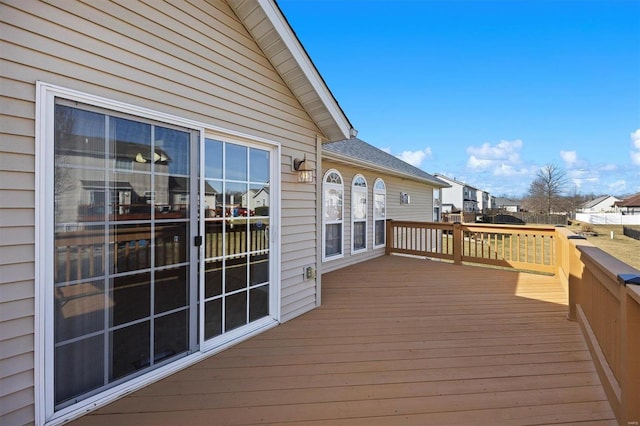 wooden terrace with a residential view