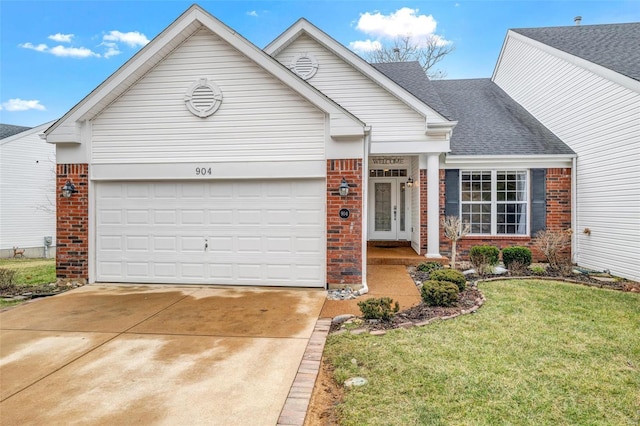 view of front facade with an attached garage, brick siding, driveway, roof with shingles, and a front yard