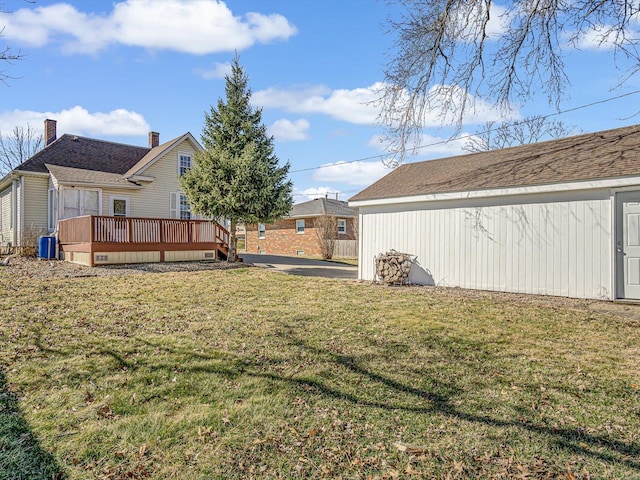 view of yard with central AC and a wooden deck