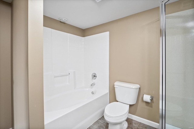 bathroom with tile patterned floors, toilet, and baseboards