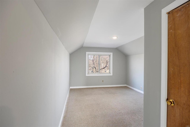 bonus room featuring carpet floors, lofted ceiling, and baseboards