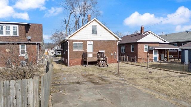 back of property featuring fence private yard and brick siding