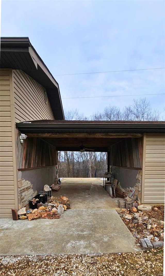 exterior space with driveway and an attached carport