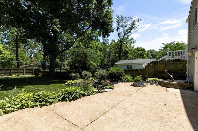 view of patio / terrace featuring an outdoor fire pit and fence