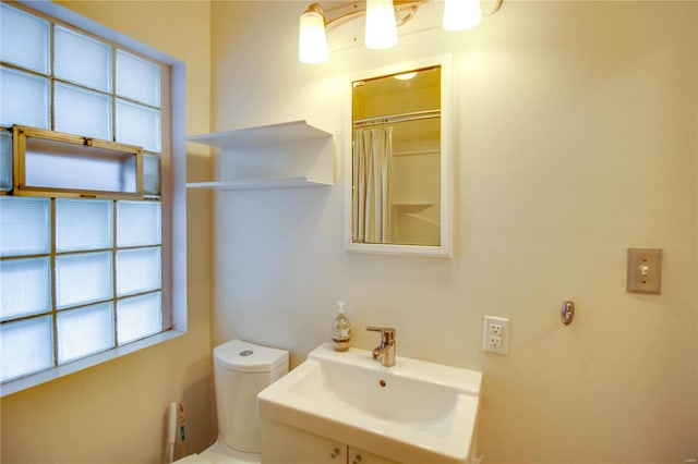 full bath featuring toilet and vanity