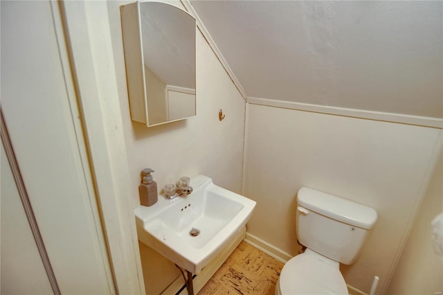 half bath featuring a sink and toilet