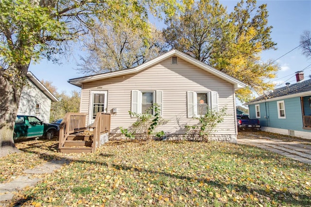 back of property featuring a yard