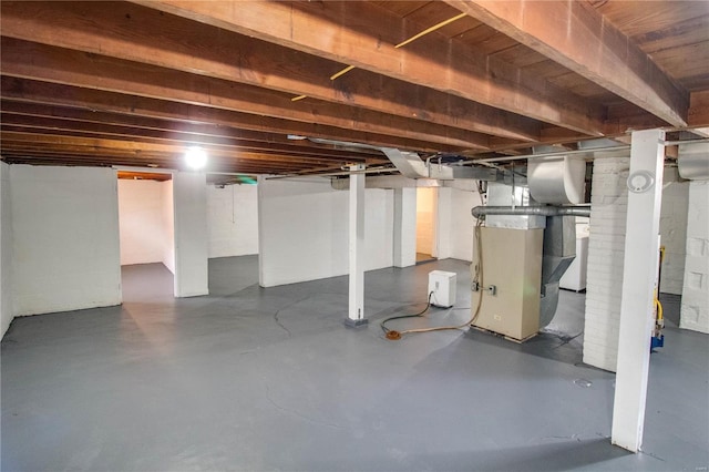 unfinished basement with heating unit