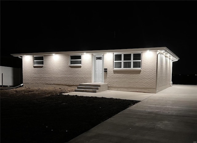 view of front of property featuring brick siding