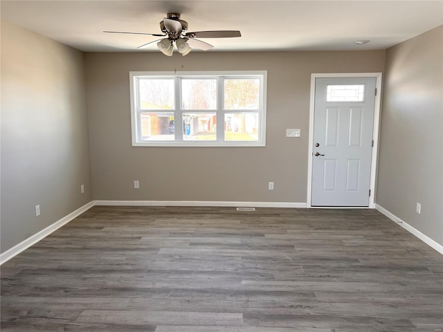 foyer with wood finished floors, baseboards, and ceiling fan