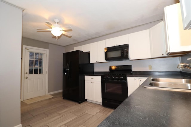 kitchen with ceiling fan, a sink, white cabinetry, black appliances, and dark countertops