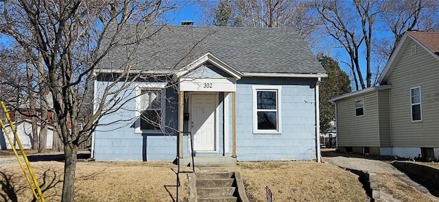 view of front of home with a shingled roof