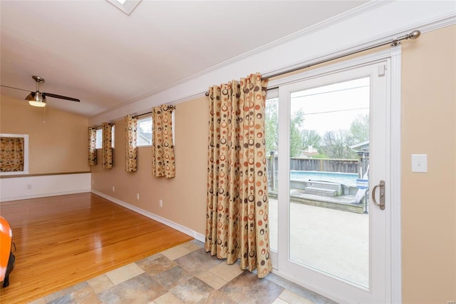 entryway featuring ceiling fan, visible vents, light wood-style floors, vaulted ceiling, and baseboards