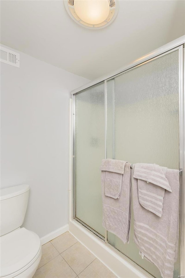 bathroom with visible vents, an enclosed shower, toilet, and tile patterned floors