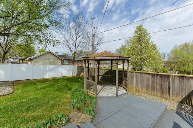 view of yard featuring a fenced backyard, a deck, and a gazebo