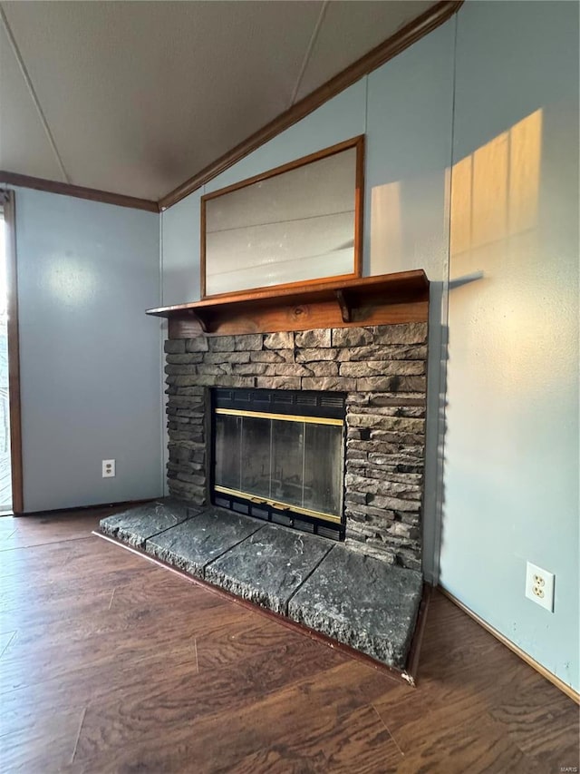 room details with crown molding, a fireplace, and wood finished floors