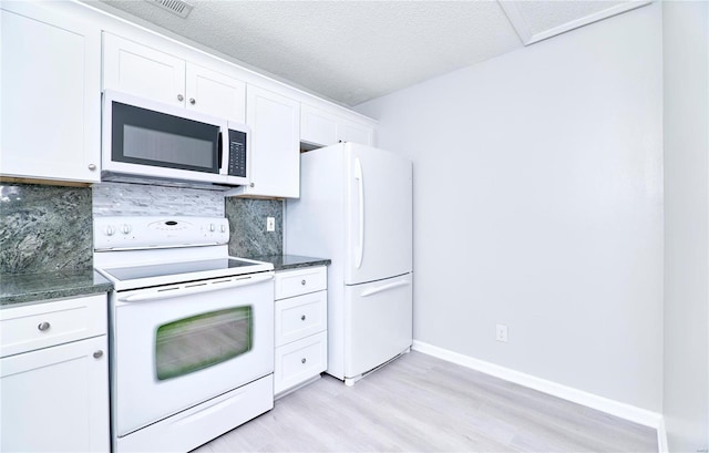 kitchen featuring tasteful backsplash, white cabinetry, baseboards, white appliances, and light wood-style flooring