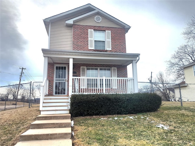 view of front of home featuring brick siding, covered porch, a front yard, and fence