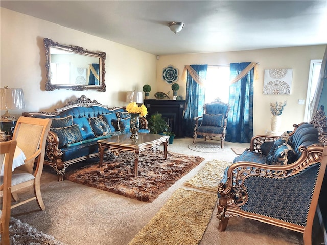 living room with carpet and a fireplace