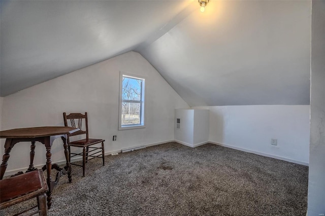 additional living space featuring vaulted ceiling, carpet floors, and baseboards