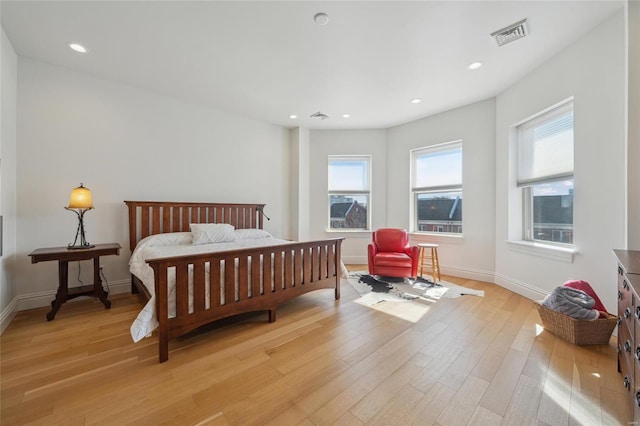 bedroom featuring recessed lighting, visible vents, baseboards, and light wood-style floors