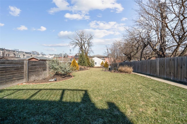 view of yard with a fenced backyard