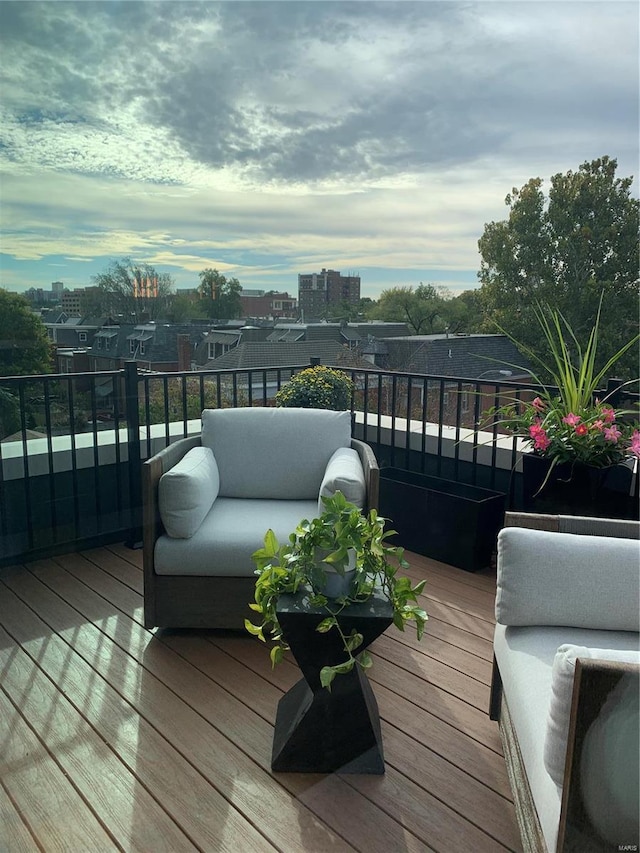 wooden deck featuring a view of city