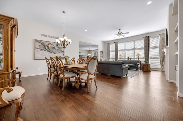 dining area with dark wood-style floors, baseboards, visible vents, and recessed lighting