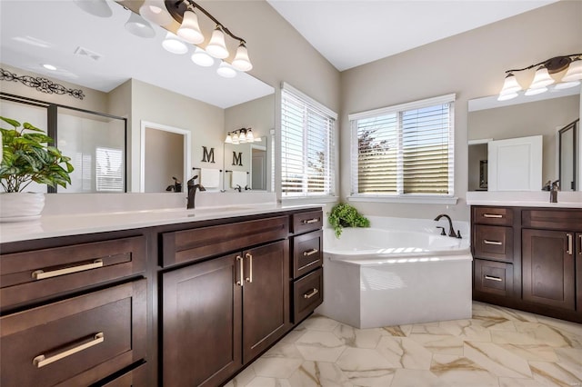 bathroom with two vanities, a sink, visible vents, marble finish floor, and a bath