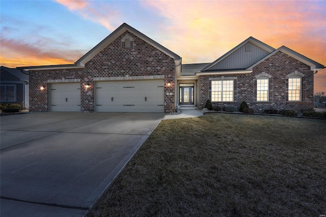 view of front of home with brick siding, concrete driveway, board and batten siding, a garage, and a front lawn