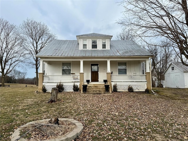 view of front of home featuring covered porch and metal roof