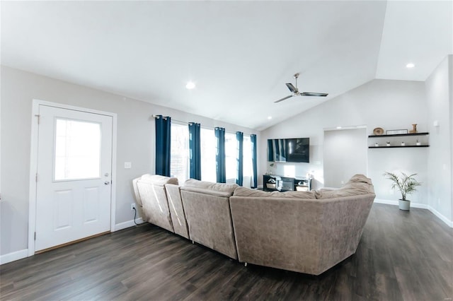 living area featuring dark wood-style floors, vaulted ceiling, baseboards, and a ceiling fan