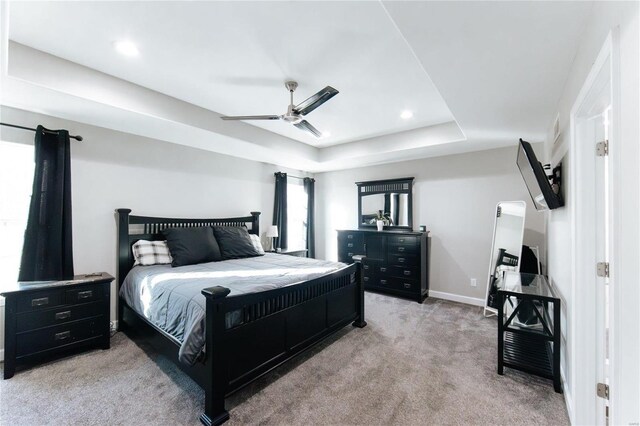 bedroom with baseboards, a raised ceiling, a ceiling fan, carpet floors, and recessed lighting