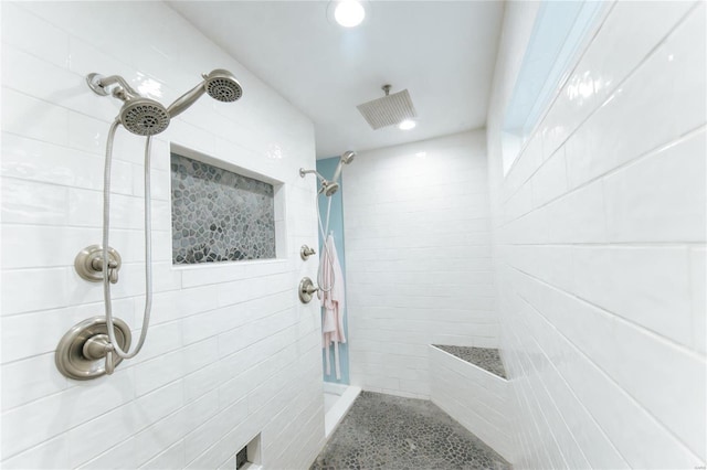 bathroom with tiled shower