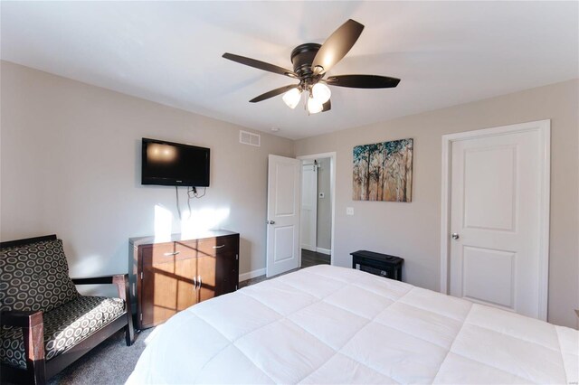 bedroom featuring ceiling fan and visible vents