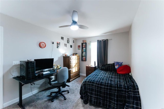 bedroom featuring carpet flooring, a ceiling fan, and baseboards