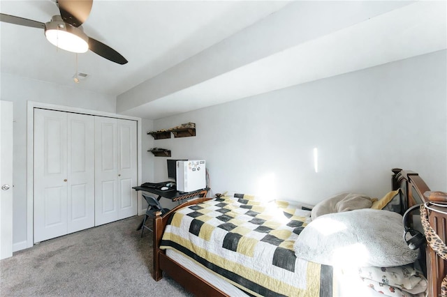 carpeted bedroom with a ceiling fan and a closet