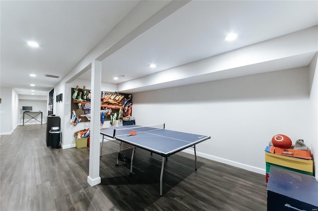 rec room featuring baseboards, visible vents, and wood finished floors