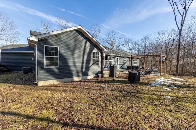 view of side of property with central AC unit