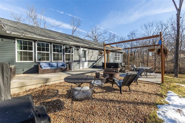 exterior space with a patio area and a fire pit