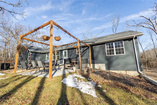 rear view of property featuring a patio