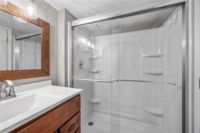 full bathroom featuring a shower stall and vanity