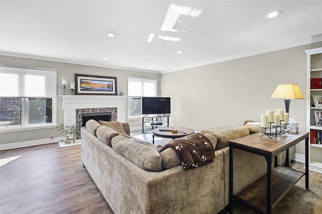 living area with recessed lighting, dark wood-style flooring, a fireplace, baseboards, and ornamental molding