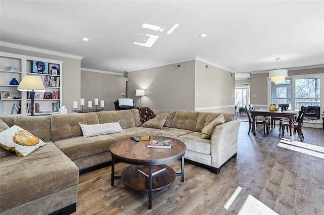 living area featuring crown molding, visible vents, wood finished floors, and recessed lighting