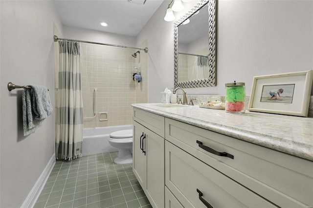 bathroom with toilet, vanity, baseboards, tile patterned floors, and shower / bath combo